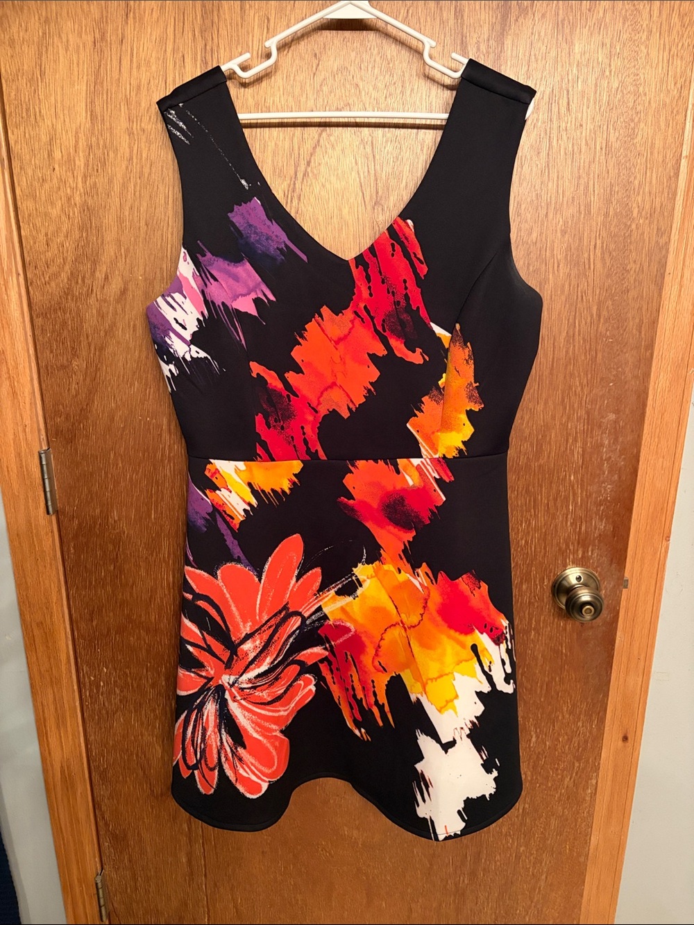 Sleeveless Black Floral V-Neck Women's Top with Red & Orange Print